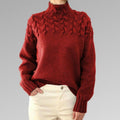 Pull à col roulé en maille torsadée pour femme avec poignets côtelés