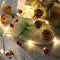 Battery Operated LED Christmas Garland Lights with Warm White String and Pine Cones - Image 1