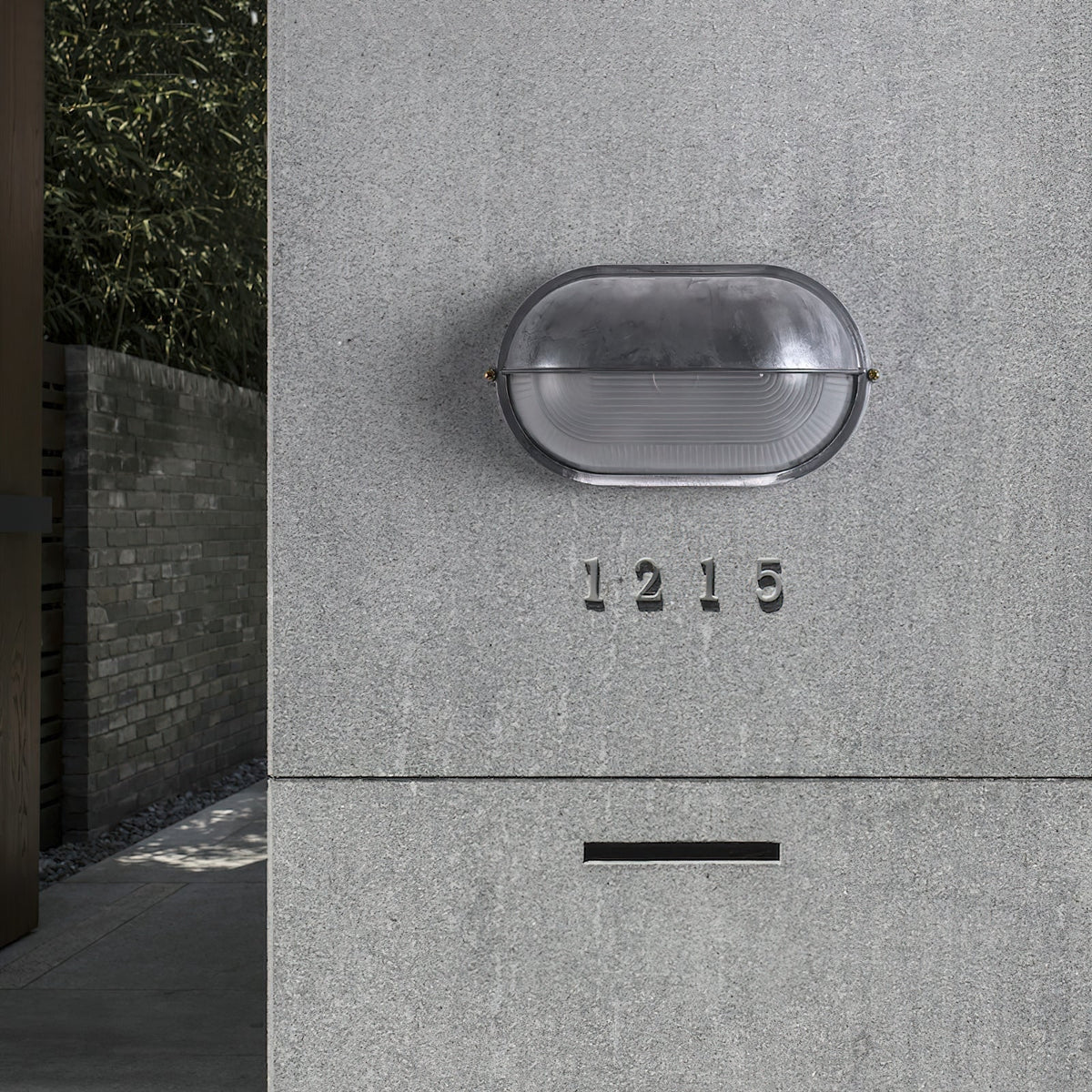 Outdoor Industrial Wall Light with Oval Bulkhead Design and Ribbed Glass Diffuser - Image 9