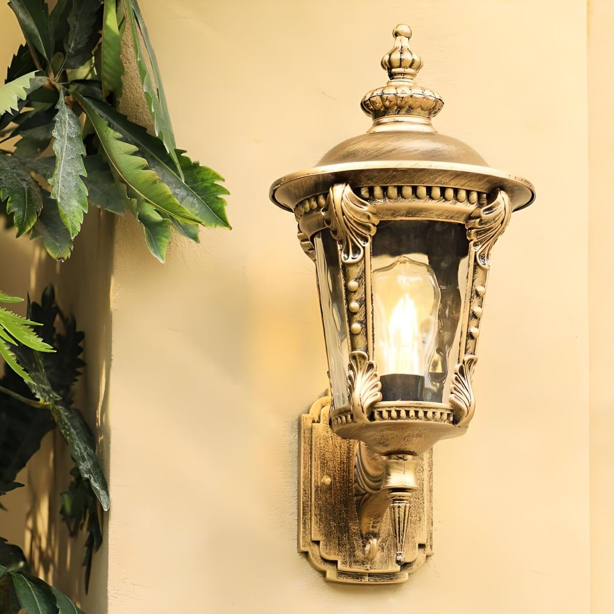 Outdoor Wall Sconce with Antique Brass Finish and Textured Glass Lantern Design - Image 2