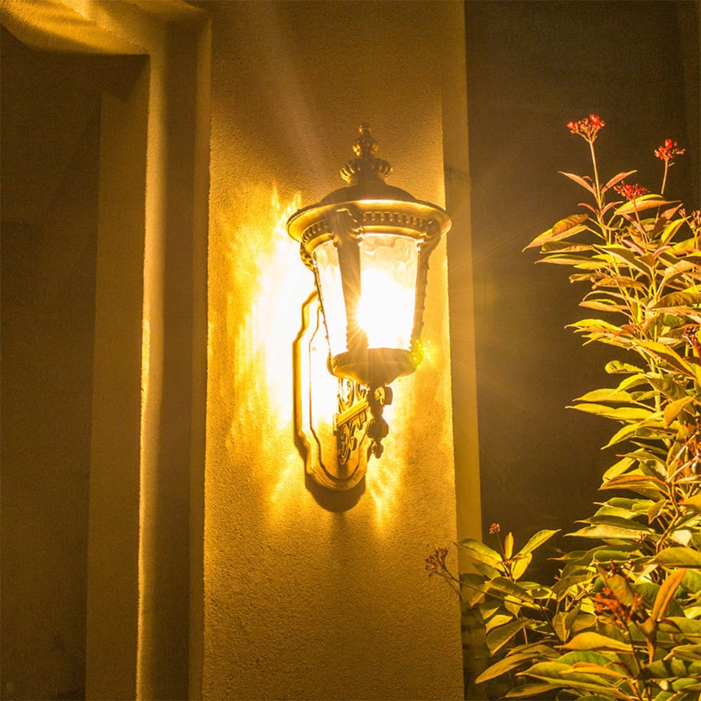 Outdoor Wall Sconce with Antique Brass Finish and Textured Glass Lantern Design - Image 9